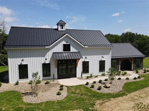 aqua board and baton house with metal roof|batten house with metal roof.